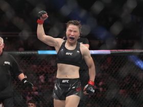 4:3 Zhang Weili (red gloves) reacts after the fight against Joanna Jedrzejczyk (blue gloves) during UFC 275 at Singapore Indoor Stadium. Mandatory Credit: Paul Miller-USA TODAY Sports