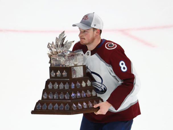 Colorado Avalanche defenseman Cale Makar (8) skates with the Conn Smythe Trophy. Ⓒ Mark J. Rebilas-USA TODAY Sports