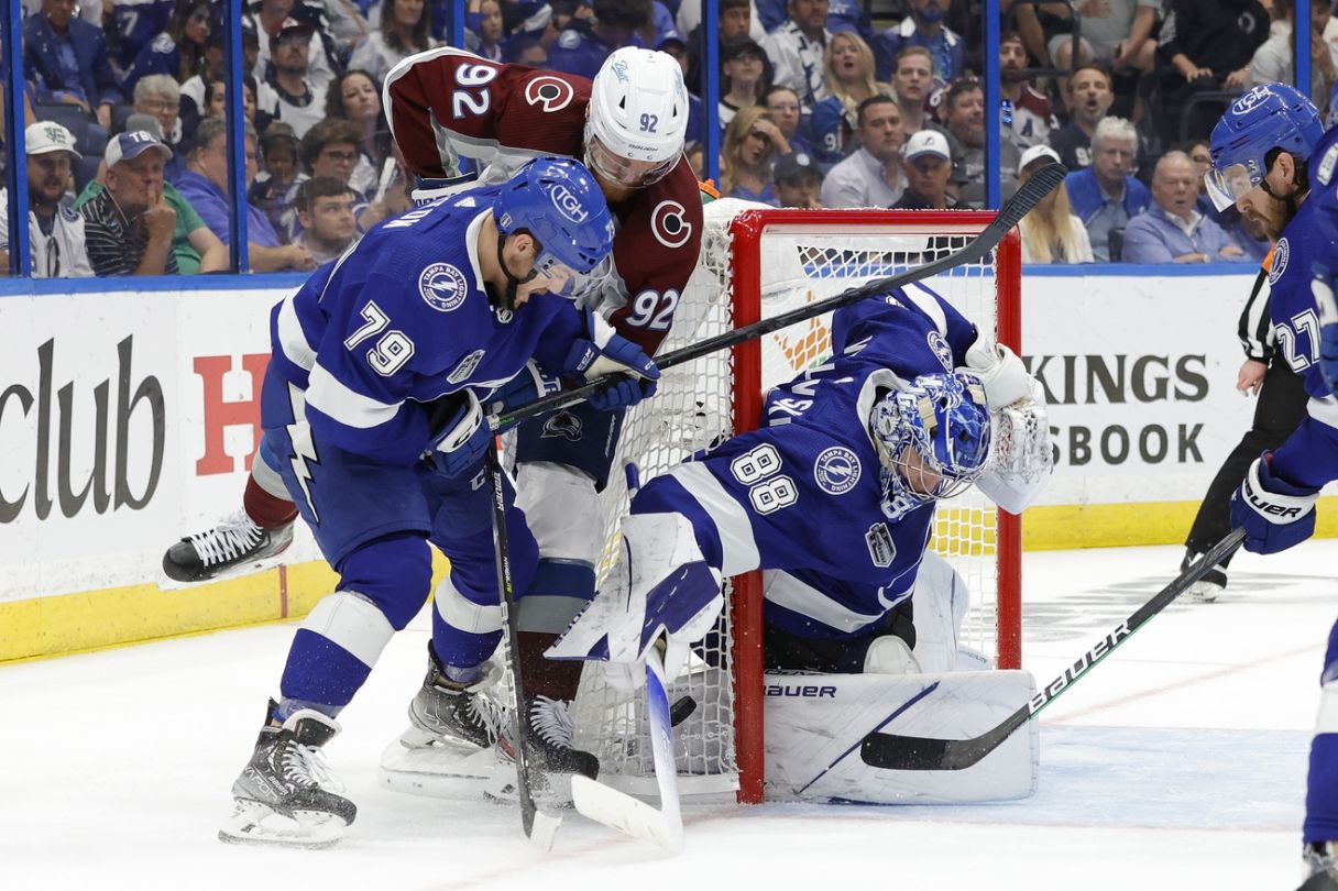 Andrei Vasilevskiy (88) makes a save on Colorado Avalanche left wing Gabriel Landeskog (92) as Lightning center Ross Colton (79) defends in game six of the 2022 Stanley Cup Final at Amalie Arena. Mandatory Credit: Geoff Burke-USA TODAY Sports