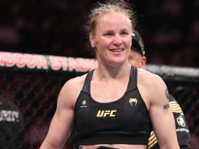 4:3 Valentina Shevchenko (red gloves) reacts after the fight against Taila Santos (blue gloves) during UFC 275 at Singapore Indoor Stadium. Mandatory Credit: Paul Miller-USA TODAY Sports