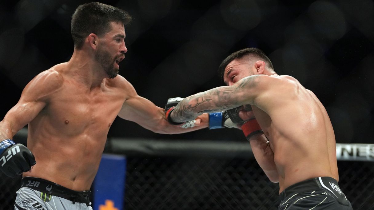 Pedro Munhoz defends against Dominick Cruz during UFC 269 at T-Mobile Arena. Mandatory Credit: Stephen R. Sylvanie-USA TODAY Sports