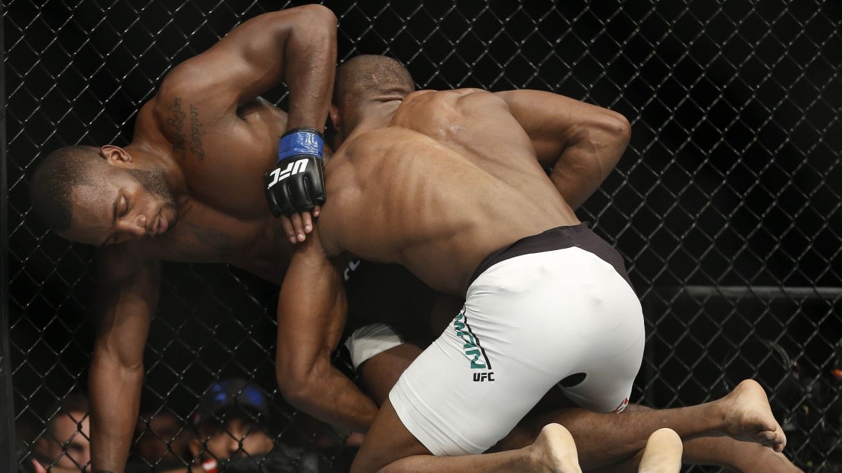 Kamaru Usman pins Leon Edwards against the cage during their first fight. Pic: Reinhold Matay-USA TODAY Sports