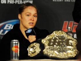4:3 Ronda Rousey answers questions from reporters after defending her title against Sara McMann in the first round of the main event of UFC 170 at Mandalay Bay. Mandatory Credit: Stephen R. Sylvanie-USA TODAY Sports