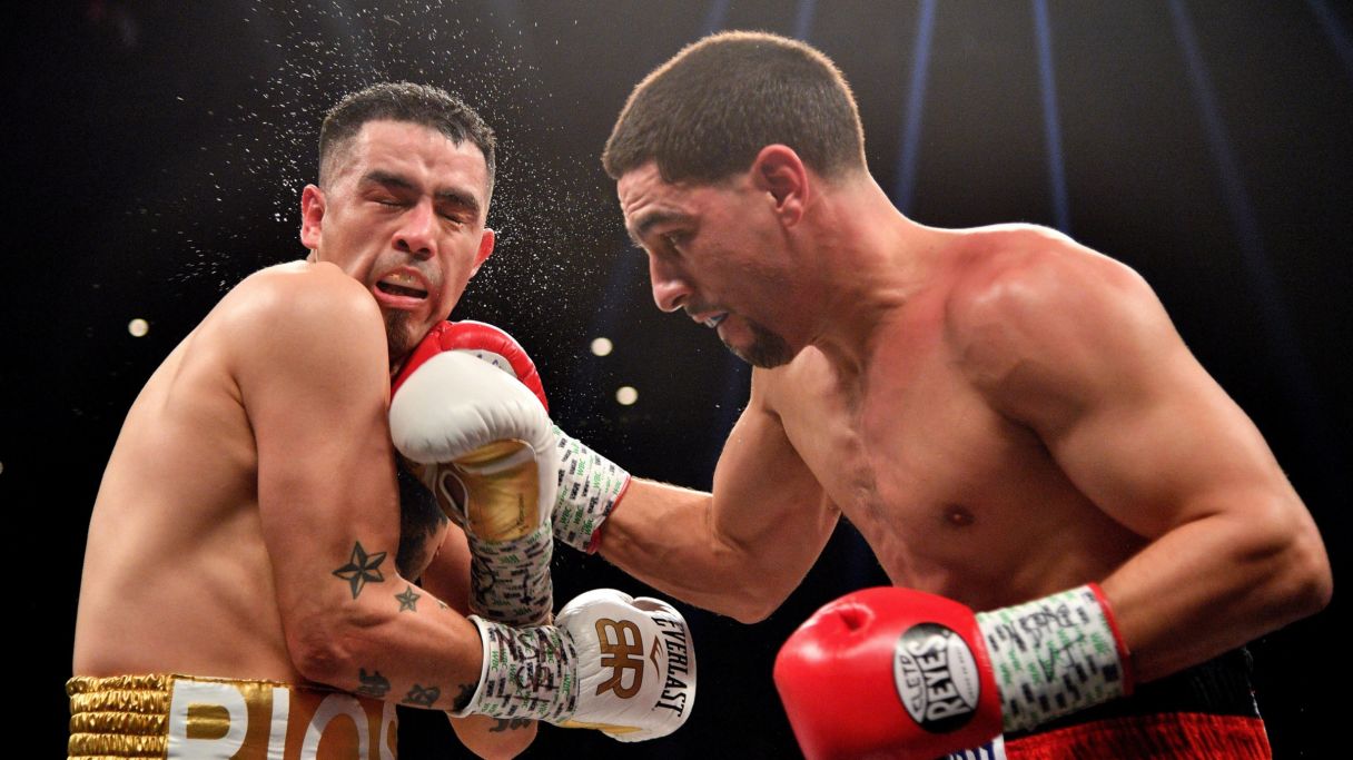 Danny Garcia (red trunks) and Brandon Rios (white trunks) box during a boxing match at Mandalay Bay Events Center. Garcia won via ninth round TKO. Mandatory Credit: Joe Camporeale-USA TODAY Sports