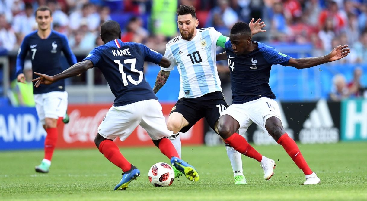 Argentina forward Lionel Messi (10) chases the ball between France midfielder Ngolo Kante (13) and midfielder Blaise Matuidi (14)