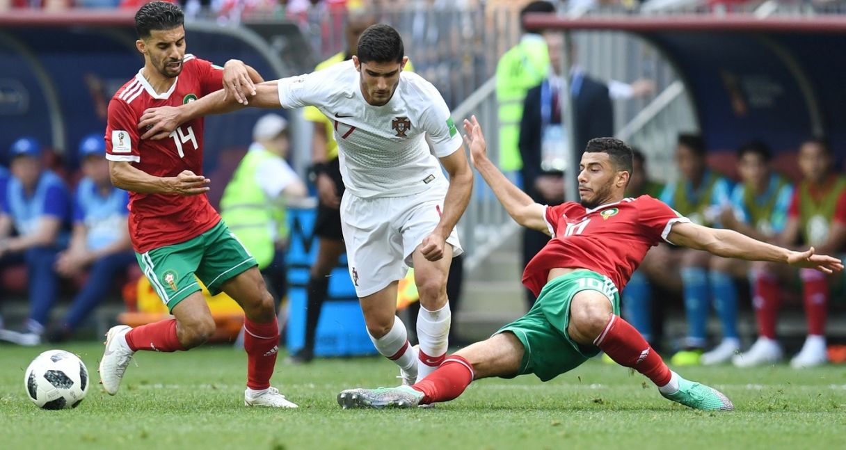 Portugal midfielder Goncalo Guedes battles Morocco midfielders Mbark Boussoufa and Morocco Younes Belhanda