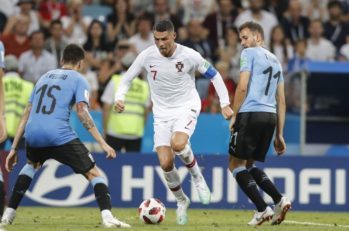 Portugal's Cristiano Ronaldo against Uruguay's Cristhian Stuani and Matias Vecino at the 2018 World Cup. © Sipa USA-USA TODAY Sports