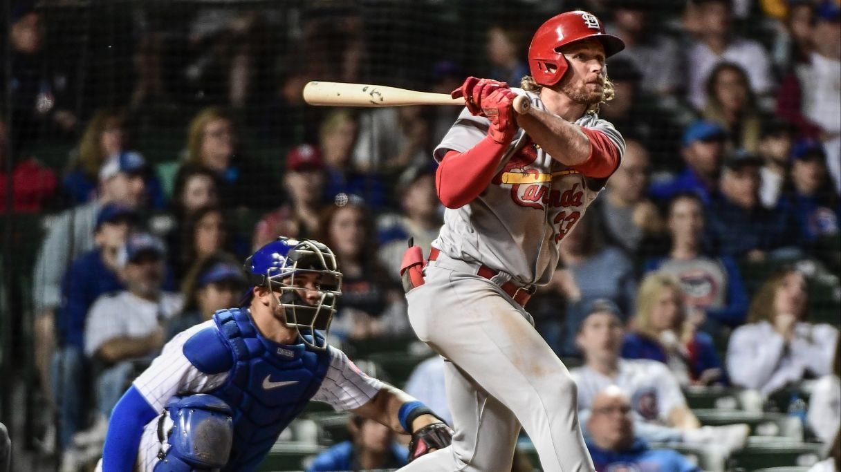 St. Louis Cardinals right fielder Brendan Donovan hits a double to drive in a run in the 11th inning as Chicago Cubs catcher Willson Contreras  watches